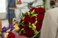 Bouquet of roses in man hands. Weddind details in closeup view. Solemn event