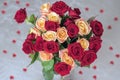 Bouquet of roses of two colors for beloved, many red hearts, top view, symbol of love,Valentine`s feast and romantic Royalty Free Stock Photo