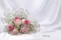 Bouquet roses and weddings rings