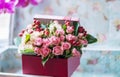 A bouquet of small roses in a box. Vintage gentle style.