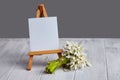 Bouquet of snowdrops and a small easel