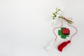 Bouquet of snowdrops on white background with red and white rope and lalybug. First of march celebration Martisor.