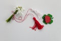 Bouquet of snowdrops on white background with red and white rope and lalybug. First of march celebration Martisor.