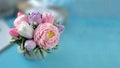 Bouquet of soap flowers on blurred blue background. Royalty Free Stock Photo