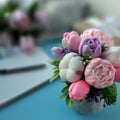 Bouquet of soap flowers on blurred blue background. Royalty Free Stock Photo