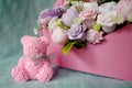 Bouquet of soap flowers and pink rose bear