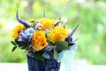 A bouquet of spring flowers. Orange roses, blue hydrangea, modern design Royalty Free Stock Photo