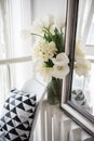 Bouquet of spring flowers in room interior, white tulips and daf Royalty Free Stock Photo