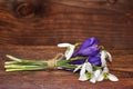 The bouquet of spring flowers snowdrops and crocuses on wood Royalty Free Stock Photo