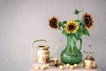 Bouquet of sunflowers and brass home decor Royalty Free Stock Photo