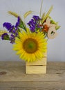 Bouquet of sunflowers, daisies, cornflowers, ears of wheat and l