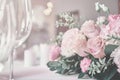 Bouquet on the table. Wine glasses in the foreground. Royalty Free Stock Photo