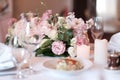 Bouquet on the table. Wine glasses in the foreground Royalty Free Stock Photo