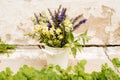 Bouquet of tea flowers. Chamomile, lemon balm and mint. Healthy diet. morning in the village. wooden background Royalty Free Stock Photo