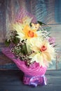 A bouquet of three orchids beautifully decorated on wooden background concept holiday gifts birthday