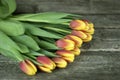 Bouquet of tulips flowers on a wooden background. Spring flowers. Selective focus. Royalty Free Stock Photo