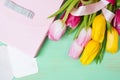 Bouquet of tulips, gift box and blank greeting card Royalty Free Stock Photo