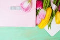 Bouquet of tulips, gift box and blank greeting card Royalty Free Stock Photo