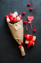 Bouquet of tulips and gift box on dark background Royalty Free Stock Photo