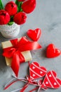 Bouquet of tulips, gift box and decorative hearts for Valentine`s, Women`s or Mother`s day. Royalty Free Stock Photo