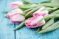 Bouquet of Tulips on turquoise rustic wooden background. Spring