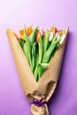 Bouquet of tulips wrapped in brown paper