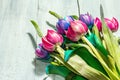 A bouquet of unusual multicolored tulips, modern hard light, dark shadow