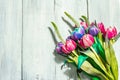 A bouquet of unusual multicolored tulips, modern hard light, dark shadow