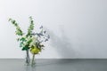 Bouquet in vase on white background. Modern lifestyle concept.