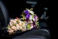 Bouquet of wedding flowers on the car seat Royalty Free Stock Photo