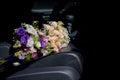 Bouquet of wedding flowers on the car seat Royalty Free Stock Photo