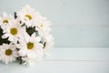Bouquet of white chrysanthemums, wooden background
