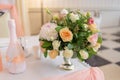 A bouquet of white, cream and pink roses stands in a vase Royalty Free Stock Photo