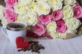 Bouquet of white and pink roses. Cup of coffee and heart. Royalty Free Stock Photo