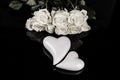 A bouquet of white roses, angels of love and porcelain hearts, Valentine`s Day Royalty Free Stock Photo