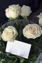 Bouquet of white roses and blank card to write a message Royalty Free Stock Photo