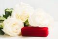 Bouquet of white roses with jewellery gift for holiday or wedding. Valentines day concept. Closeup view