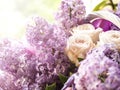 Bouquet of white roses and lilacs in close-up. Gifts and Greetings Happy Holidays.