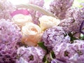 Bouquet of white roses and lilacs in close-up. Gifts and Greetings Happy Holidays.
