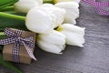 Bouquet white tulip flowers on old wooden table. Easter.Mothers