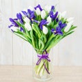 Bouquet of white tulips and blue irises Royalty Free Stock Photo