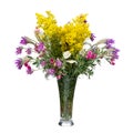 Bouquet of wild flowers in a glass vase isolated on white Royalty Free Stock Photo