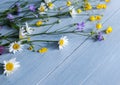 Bouquet of wild flowers on a wooden