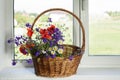 Bouquet of wildflowers on a plastic window