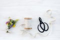 Bouquet of wildflowers with ribbon and scissors