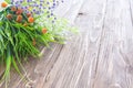 Bouquet of wildflowers on wooden. Wild flowers on an old wooden background Royalty Free Stock Photo