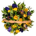 Bouquet of withered roses on a white isolated background. Top view of yellow and blue dry flowers in a wicker basket. Beautiful Royalty Free Stock Photo