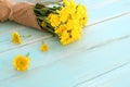 Bouquet of yellow chrysanthemum on blue wooden background. Royalty Free Stock Photo