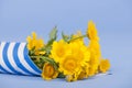 Bouquet yellow flowers on blue background