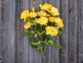 Bouquet of yellow garden roses on rustic weathered wooden backgr Royalty Free Stock Photo